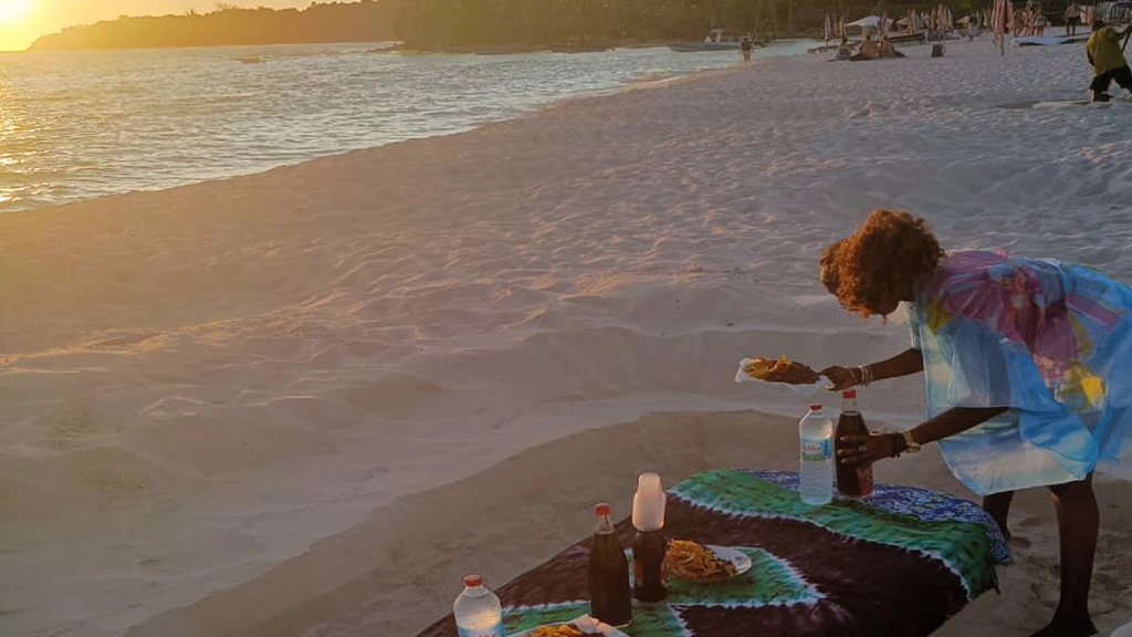 Private beach setup in Nosy Be at sunset